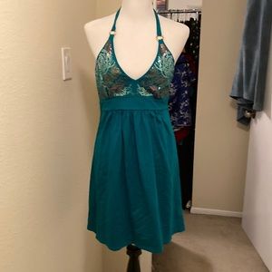 Green halter dress with sequin top embellishments.